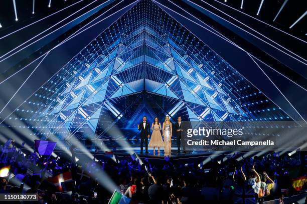Hosts Assi Azar, Lucy Ayoub, Bar Refaeli and Erez Tal on stage during the 64th annual Eurovision Song Contest held at Tel Aviv Fairgrounds on May 18,...