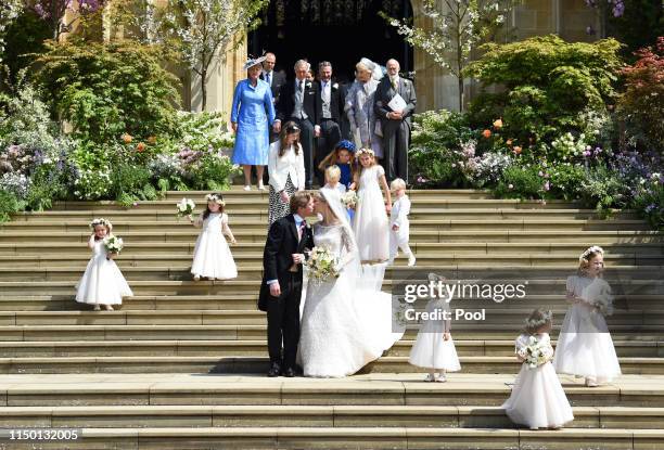 Thomas Kingston and Lady Gabriella Windsor kiss as they leave St George's Chapel after their wedding on May 18, 2019 in Windsor, England.
