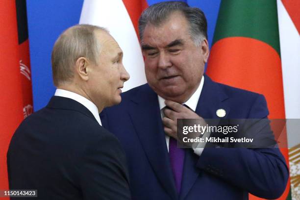 Tajik President Emomali Rakhmon greets Russian President Vladimir Putin during the 5th Summit of the Conference on Interaction and...