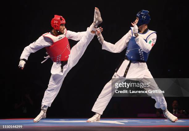 Simone Alessio of Italy competes against Ahmad Abughaush of Jordan in the Final of the Mens -74kg during Day 3 of the World Taekwondo Championships...