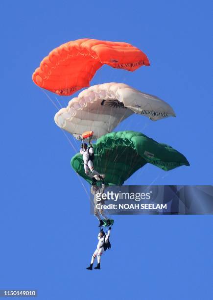 Members of Indian Air Force sky diving team 'Akash Ganga' perform during the combined graduation parade at the Indian Air Force Academy in Hyderabad...