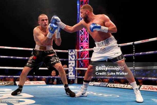 Billy Joe Saunders punches Shefat Isufi during the WBO WORLD SUPER-MIDDLEWEIGHT CHAMPIONSHIP at The Lamex Stadium on May 18, 2019 in Stevenage,...