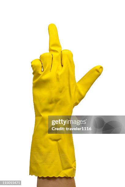 middle finger - yellow glove stock pictures, royalty-free photos & images