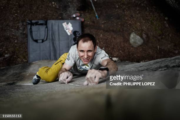 French climber Jeremy Bonder demonstrates his skills at bouldering -a form of rock climbing that is performed on small rock formations- in the...