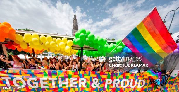 Participants of the Euro Pride 2019 gay pride parade celebrate in front of Vienna's City Hall in Vienna, Austria on June 15, 2019.