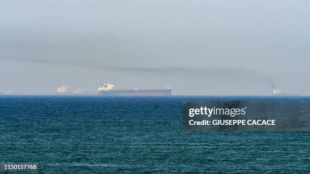 This picture taken on June 15, 2019 shows tanker ships in the waters of the Gulf of Oman off the coast of the eastern UAE emirate of Fujairah.