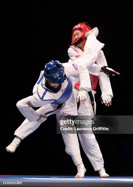 Farida Azizova of Azerbaijan competes against Mengyu Zhang of China in the Semi Final of the Women’s -67kg during Day 4 of the World Taekwondo...