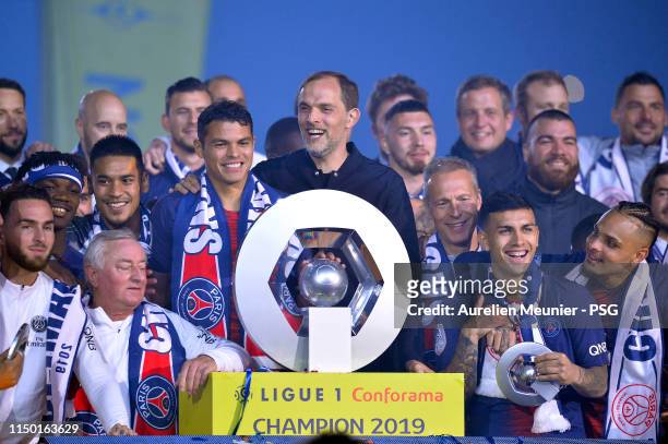 Paris Saint-Germain head coach Thomas Tuchel and Paris Saint-Germain Captain Thiago Silva react as they receive the French Ligue 1 championship...