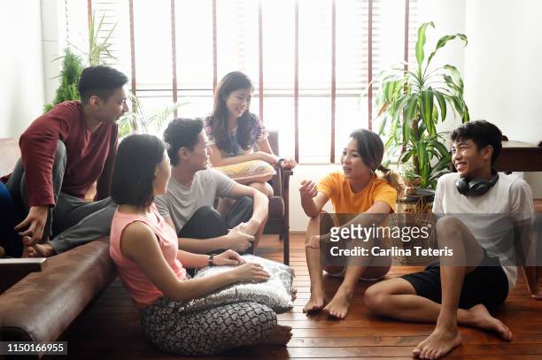 young roommates in their apartment in the morning - chinese ethnicity ストックフォトと画像