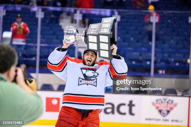 Charlotte Checkers goaltender Dustin Tokarski celebrates after game five of the AHL Calder Cup Finals against the Chicago Wolves on June 8 at the...