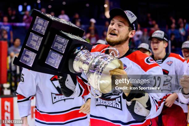 Charlotte Checkers right wing Julien Gauthier celebrates after game five of the AHL Calder Cup Finals against the Chicago Wolves on June 8 at the...