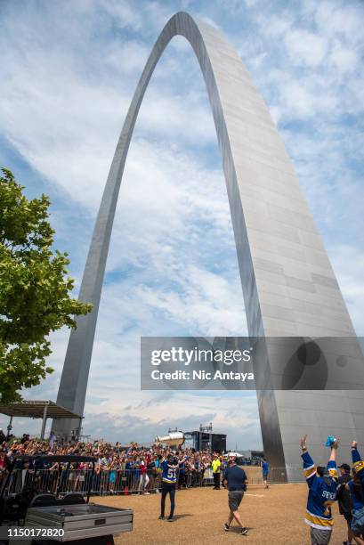 David Perron of the St. Louis Blues runs with the Stanley Cup toward The Gateway Arch during the St Louis Blues Victory Parade and Rally after...