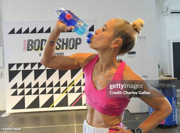 Lacey Stone leads a workout during FIJI Water at SHAPE Body Shop 2019 at Hudson Loft on June 15, 2019 in Los Angeles, California.