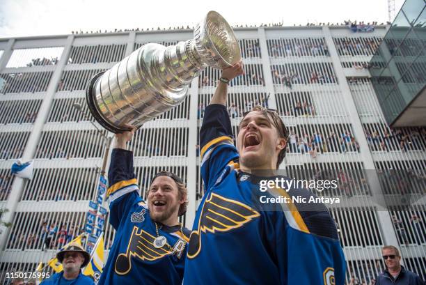 Vladimir Tarasenko of the St. Louis Blues and Sammy Blais of the St. Louis Blues hoist the Stanley Cup during the St Louis Blues Victory Parade and...