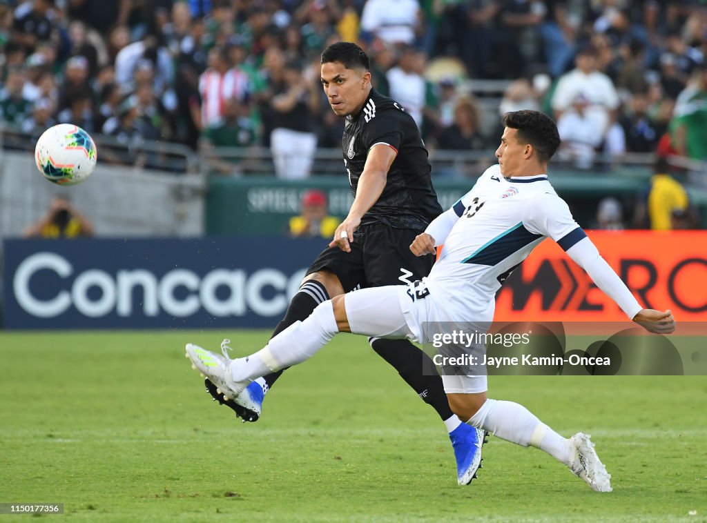 Carlos Salcedo of Mexico passes the ball down field past Luis... News ...