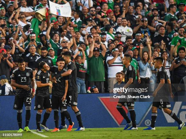 Uriel Antuna of Mexico celebrates his second goal with Jesus Gallardo of Mexico during the 2019 CONCACAF Gold Cup Group A match between Mexico and...