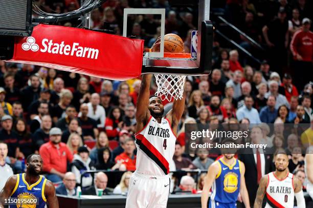 Maurice Harkless of the Portland Trail Blazers dunks the ball during the first half against the Golden State Warriors in game three of the NBA...