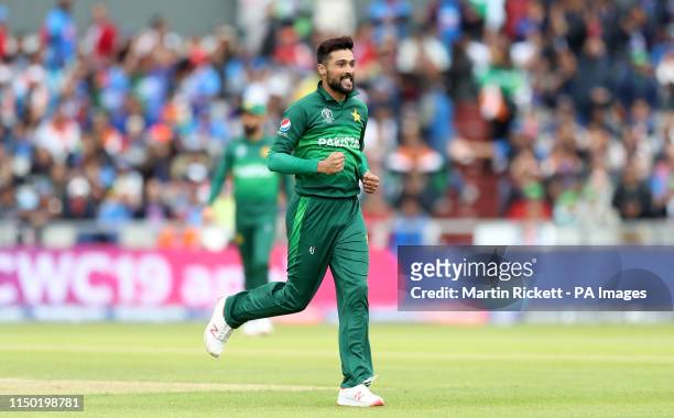 Pakistan's Mohammad Amir celebrates taking the wicket of India's Virat Kohli during the ICC Cricket World Cup group stage match at Emirates Old...