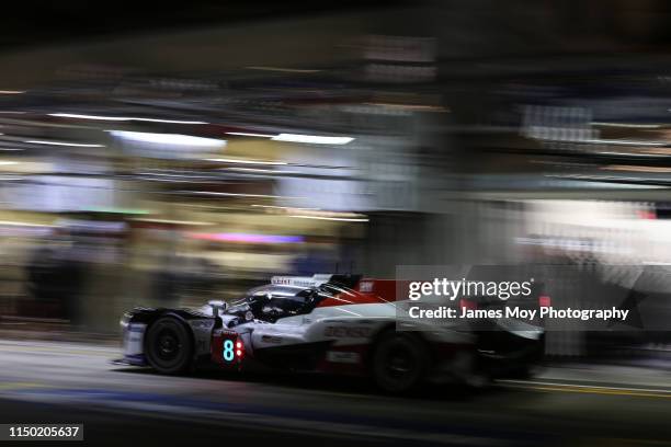 The Toyota Gazoo Racing TS050 Hybrid of Sebastien Buemi, Kazuki Nakajima and Fernando Alonso makes a pit stop during the race on June 16, 2019 in Le...