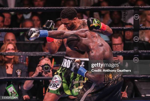 Deontay Wilder and Dominic Breazeale fight during their bout for Wilder's WBC heavyweight championship at Barclays Center on May 18, 2019 in New York...