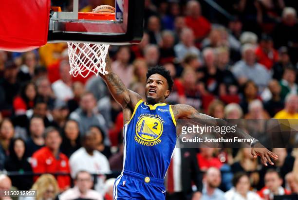 Jordan Bell of the Golden State Warriors dunks the ball against the Portland Trail Blazers in game three of the NBA Western Conference Finals at Moda...
