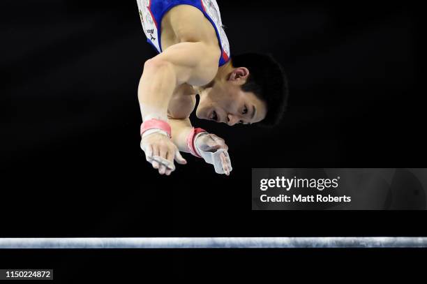 Kazuyuki Takeda of Japan competes on the Horizontal Bar during day two of the Artistic Gymnastics NHK Trophy at Musashino Forest Sport Plaza on May...