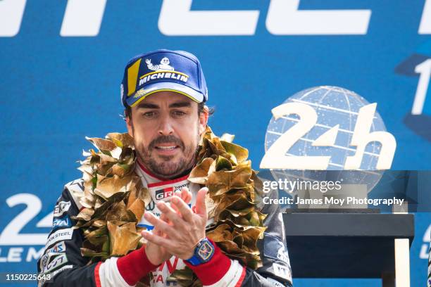 Race winner Fernando Alonso of Spain and Toyota Gazoo Racing celebrates on the podium during the 24 Hours of Le Mans on June 16, 2019 in Le Mans,...