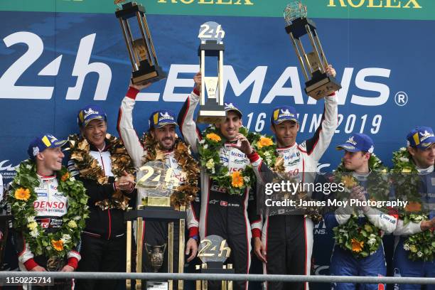 Race winners Fernando Alonso of Spain and Toyota Gazoo Racing, Sebastien Buemi of Switzerland and Toyota Gazoo Racing and Kazuki Nakajima of Japan...