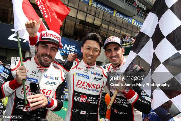 Race winners Fernando Alonso of Spain and Toyota Gazoo Racing, Kazuki Nakajima of Japan and Toyota Gazoo Racing and Sebastien Buemi of Switzerland...