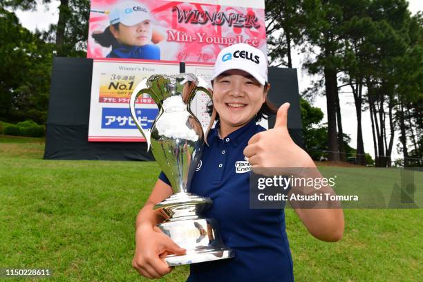 Min-Young Lee of South Korea poses for photographs with the trophy after the award ceremony following the Hoken-no-Madoguchi Ladies at Fukuoka...