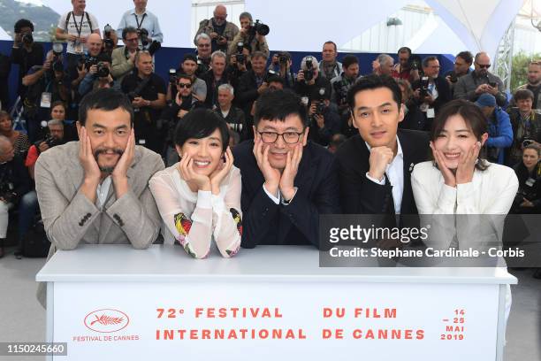 Liao Fan, Gwei Lun-Mei, Diao Yinan, Hu Ge and Wam Qian attend the photocall for "The Wild Goose Lake" during the 72nd annual Cannes Film Festival on...