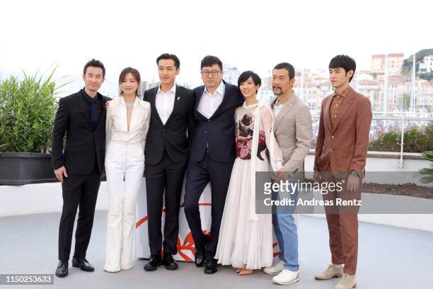 Wan Qian, Hu Ge, Diao Yinan, Gwei Lun-Mei, Liao Fan and Yichong Zhang with cast members attend the photocall for "The Wild Goose Lake" during the...