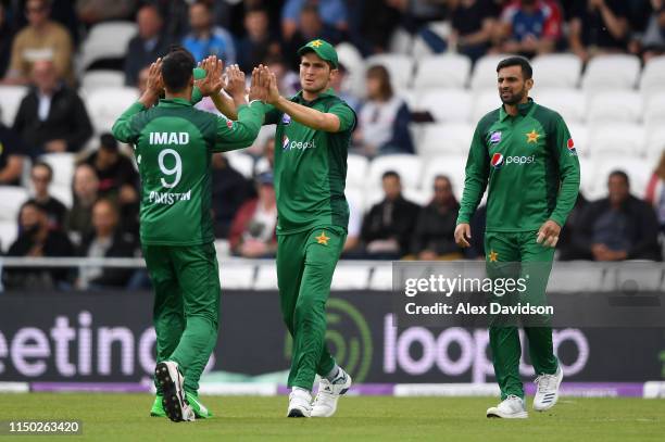 Shaheen Afridi of Pakistan celebrates the wicket of Jonny Bairstow of England with Imad Wasim of Pakistan during the 5th One Day International...