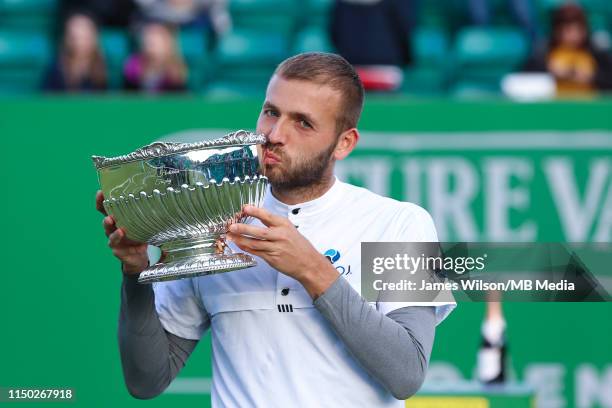 Daniel Evans of Great Britain celebrates with the winners trophy after beating Evgeny of Donskoy of Russia during day seven of the Nature Valley Open...