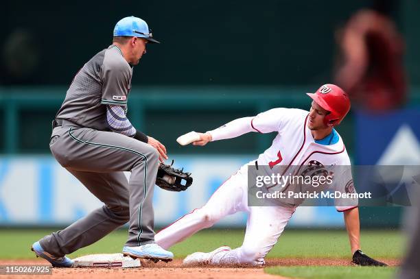 Trea Turner of the Washington Nationals steals second base against Nick Ahmed of the Arizona Diamondbacks in the second inning at Nationals Park on...