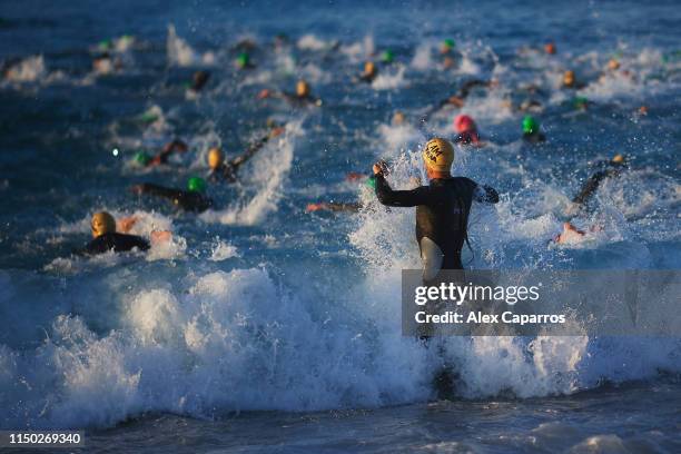 Athletes enter the sea and start the swim leg of the race during IRONMAN 70.3 Barcelona on May 19, 2019 in Calella, Spain.