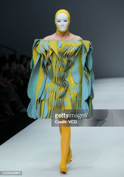 Model showcases designs on the runway during the School of Apparel Design of Zhejiang University of Science and Technology show on day six of China...