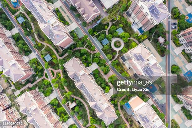 aerial view of residential building and road - city above stock pictures, royalty-free photos & images