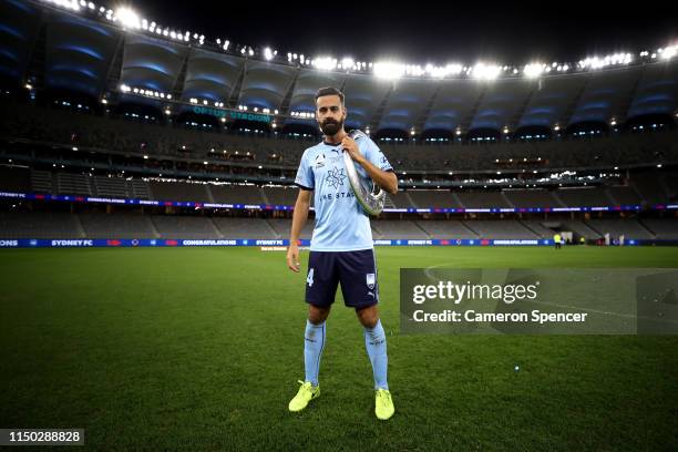 Alex Brosque of Sydney FC poses with the A-League trophy after playing his final A-League match, winning the 2019 A-League Grand Final match between...