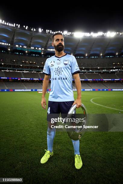 Alex Brosque of Sydney FC poses with the A-League trophy after playing his final A-League match, winning the 2019 A-League Grand Final match between...