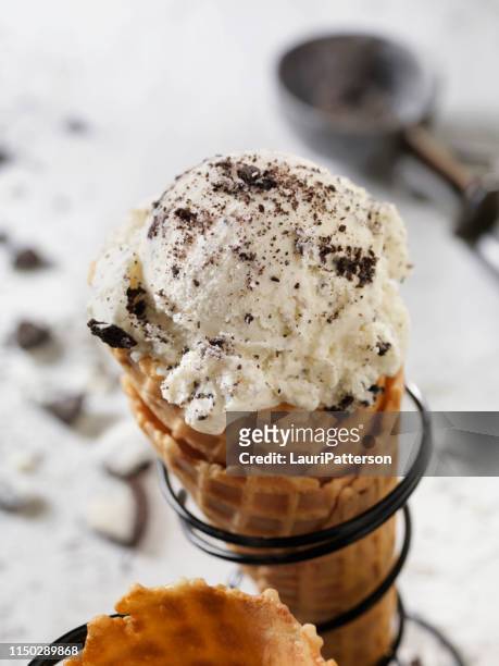 cookies and cream ice cream in a waffle cone - oreo stock pictures, royalty-free photos & images