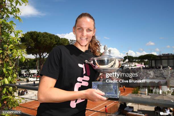 Karolina Pliskova of the Czech Republic poses for a photograph with her winners trophy after her straight sets victory against Johanna Konta of Great...