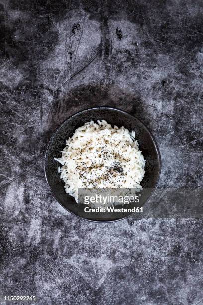 rice in bowl, from above - rice bowl stock-fotos und bilder