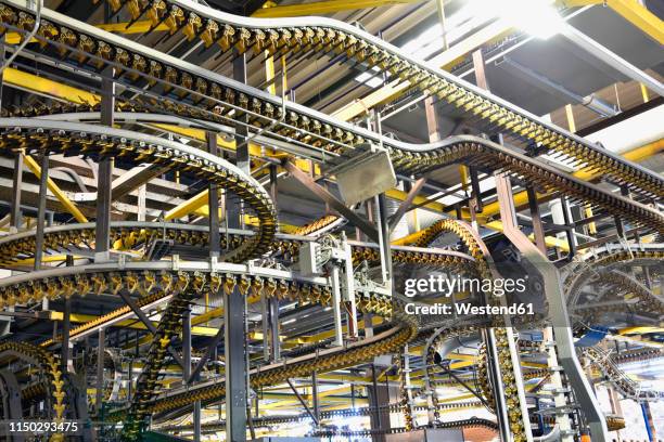 machines for transport in a printing shop - conveyor belt stock pictures, royalty-free photos & images