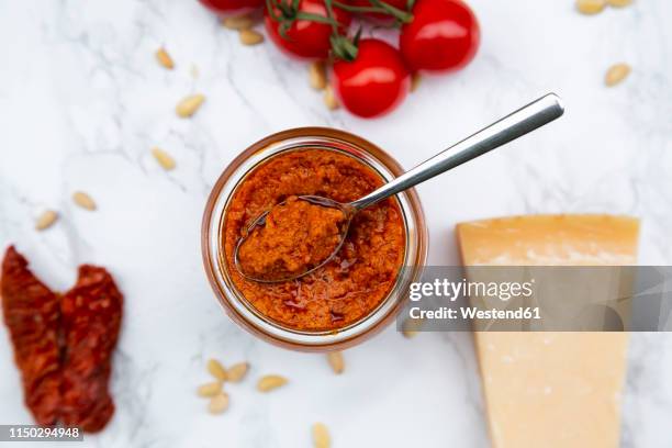 ingredients of tomato pesto - pesto stock-fotos und bilder