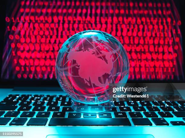 globe illustrating the americas on a laptop computer with screen been infected by a cyber attack - ominous computer stock pictures, royalty-free photos & images