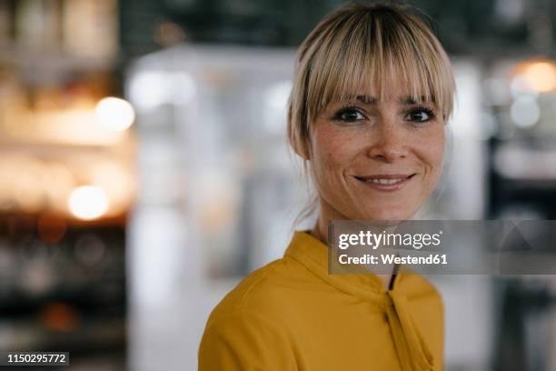 portrait of a beautiful blond woman, smiling - portrait blurred background stock pictures, royalty-free photos & images