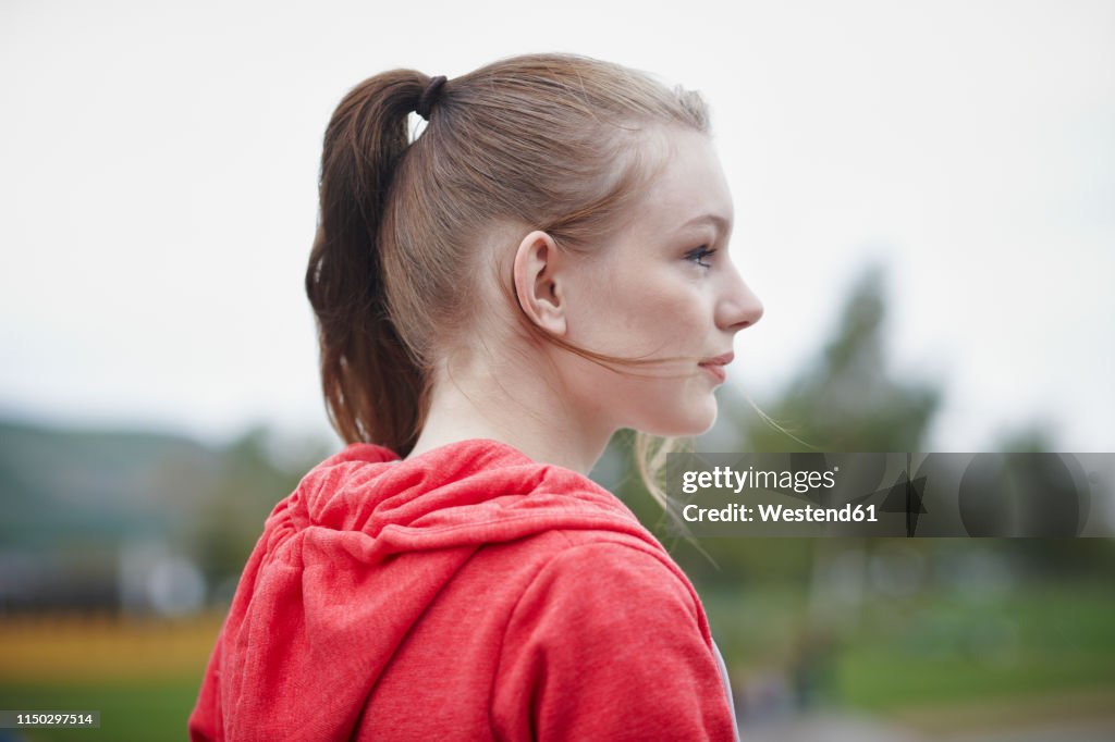 Profile of teenage girl with pigtail