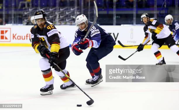 Yasin Ehliz of Germany challenges Patrick Kane of United States during the 2019 IIHF Ice Hockey World Championship Slovakia group A game between...