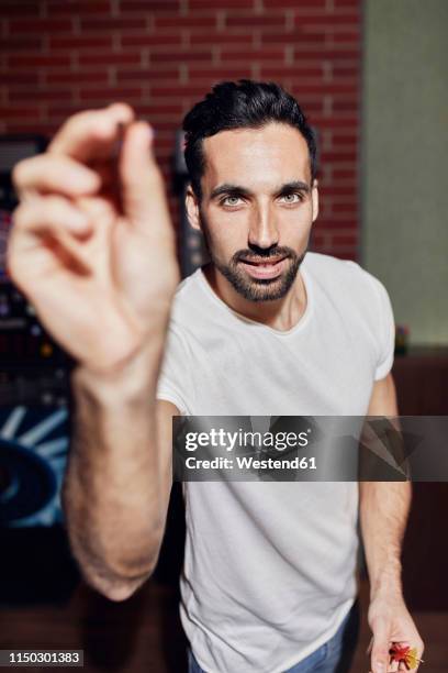 portrait of man playing darts - pub darts stock pictures, royalty-free photos & images